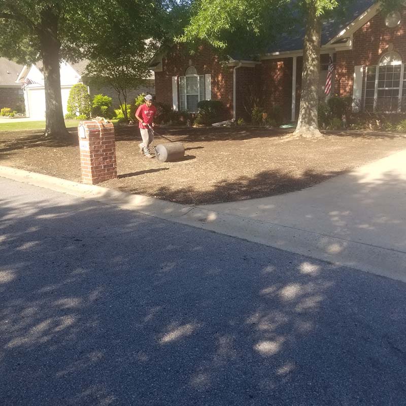 American Services professional performing landscaping work