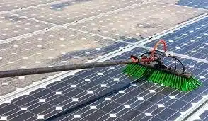 Commercial Solar Panel Cleaning Arkansas | Solar Farm Cleaning 1 Commercial solar panel cleaning with extension brush on large array in Arkansas — American Services AR professional solar farm cleaning
