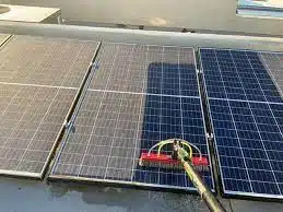 Solar Panel Cleaning in Little Rock, AR | American Services AR 1 Solar panel cleaning in progress in Little Rock AR — professional deionized water wash with soft-bristle brush, American Services AR